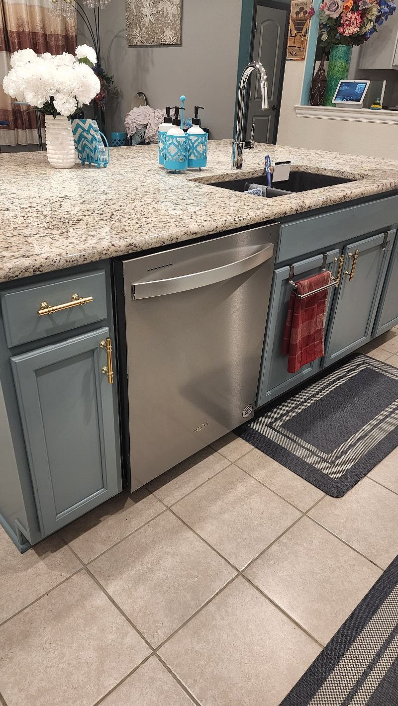 Kitchen with dishwasher and sink.