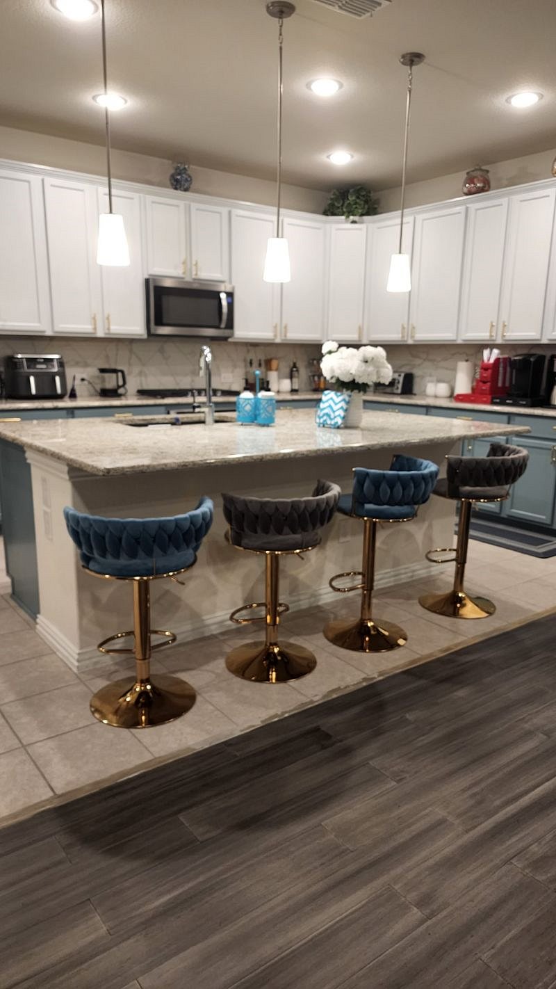 Kitchen on first floor with microwave, gas stove and oven.