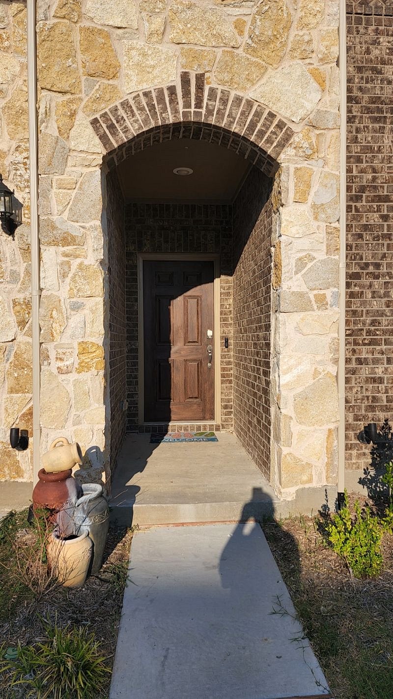 Front entrance to the house with smart keyless entry.
