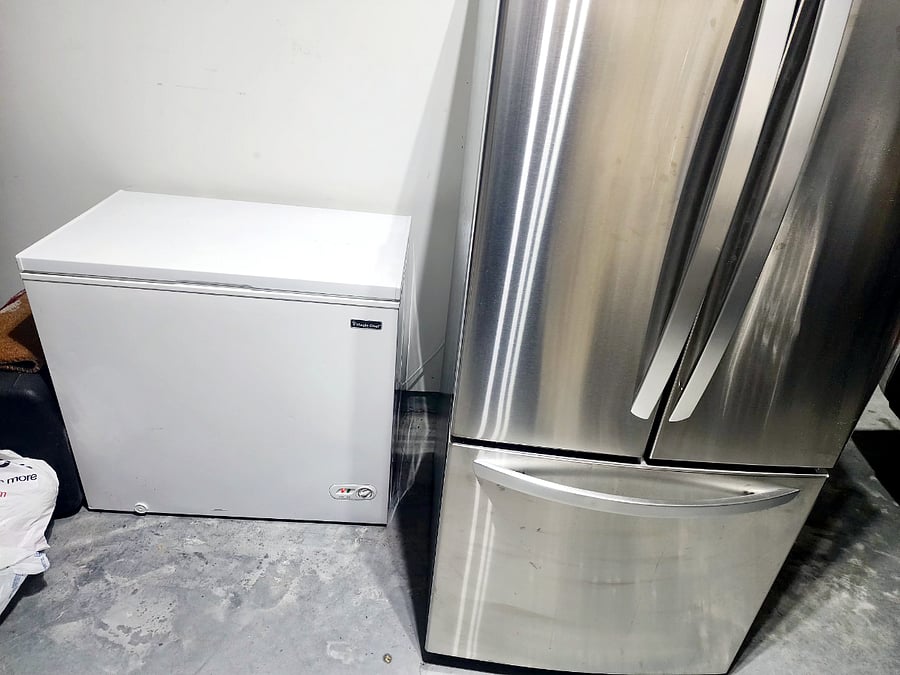 Refrigerator in garage. Freezer chest is for host.