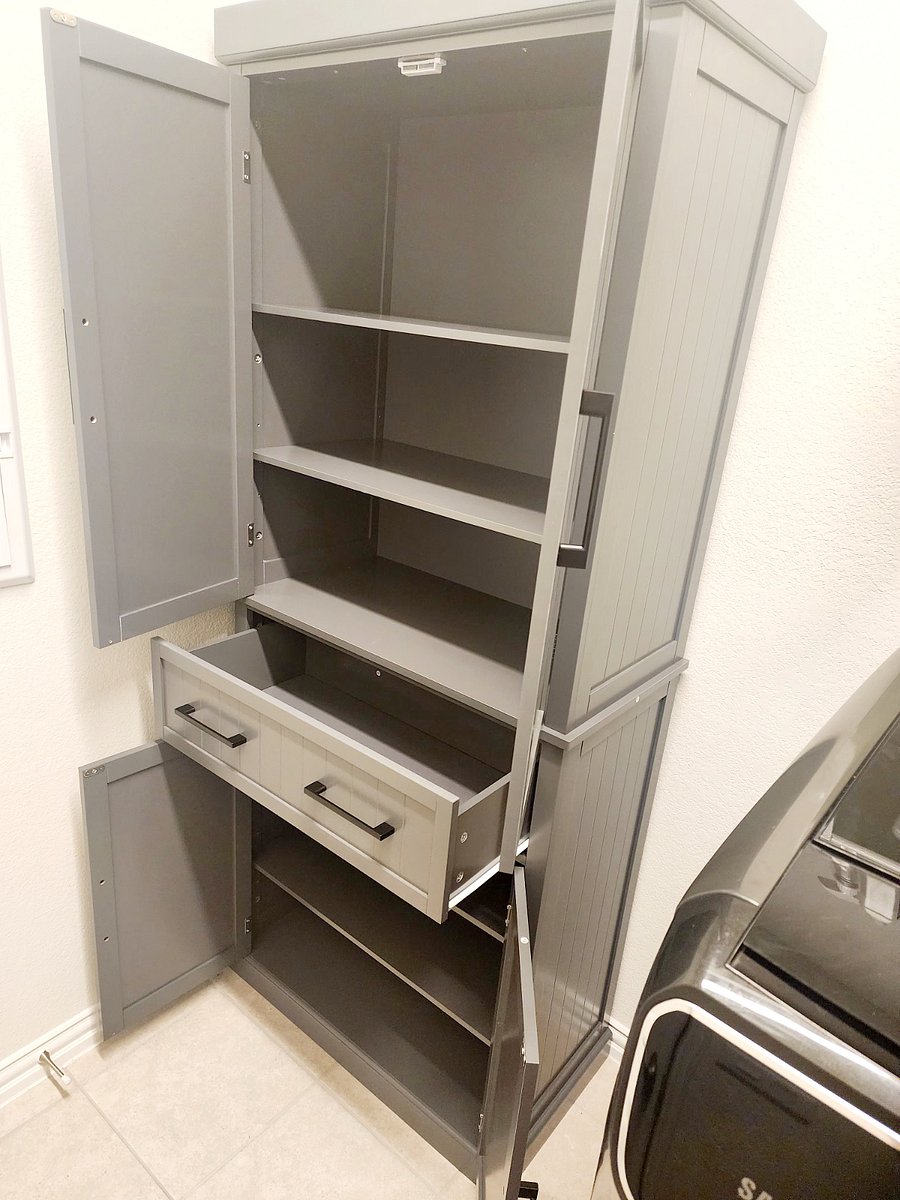 Pantry closet for guests in laundry room.
