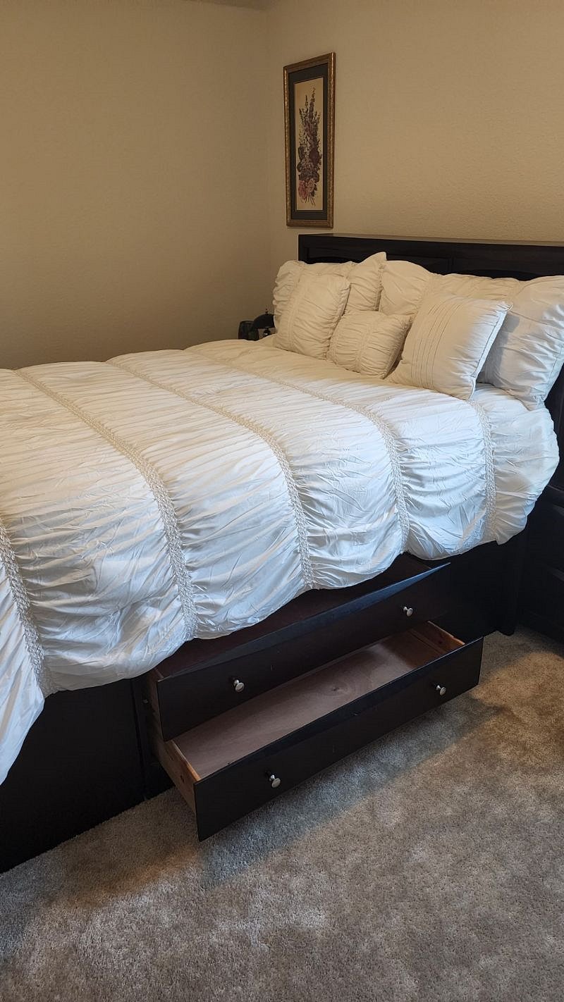 Captains bed with night stands.