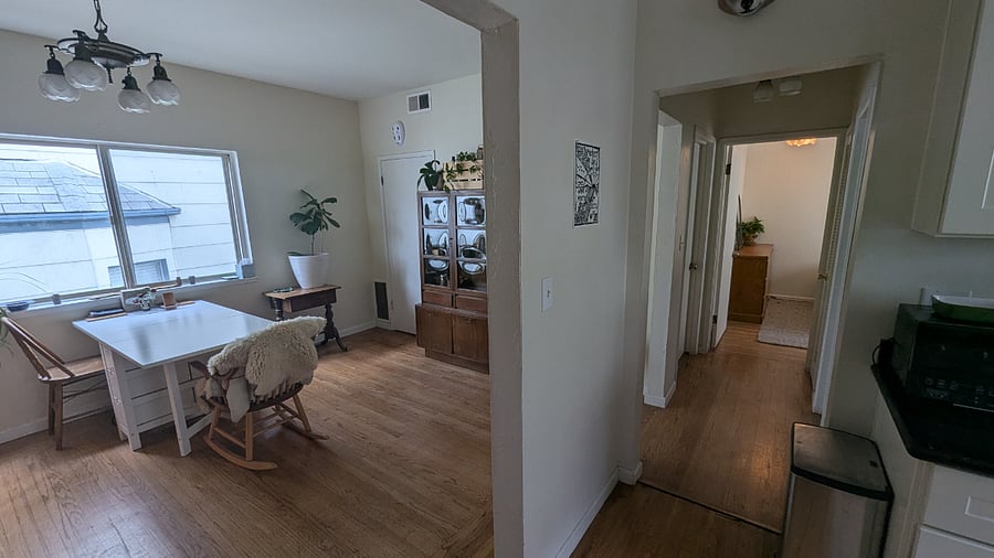 Dining room with hallway to bedrooms and bathroom