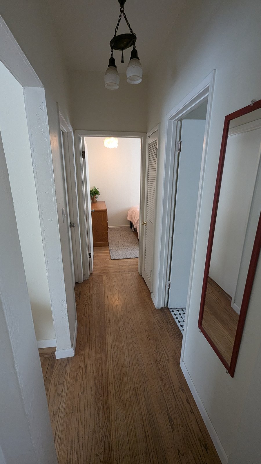 View into your room from the hallway, Kitchen behind viewer, Bathroom to right past mirror