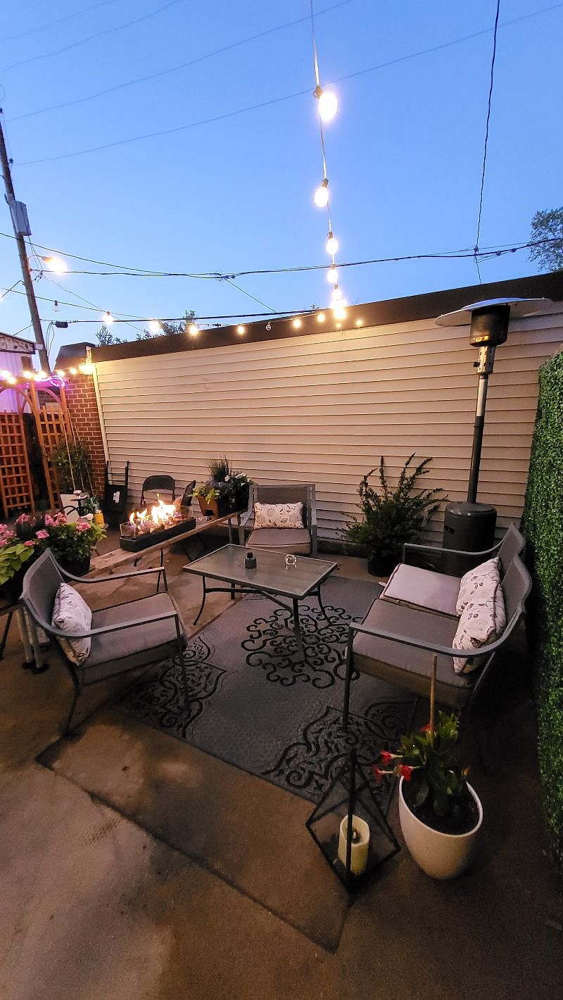 Exterior patio with grill and firepit.