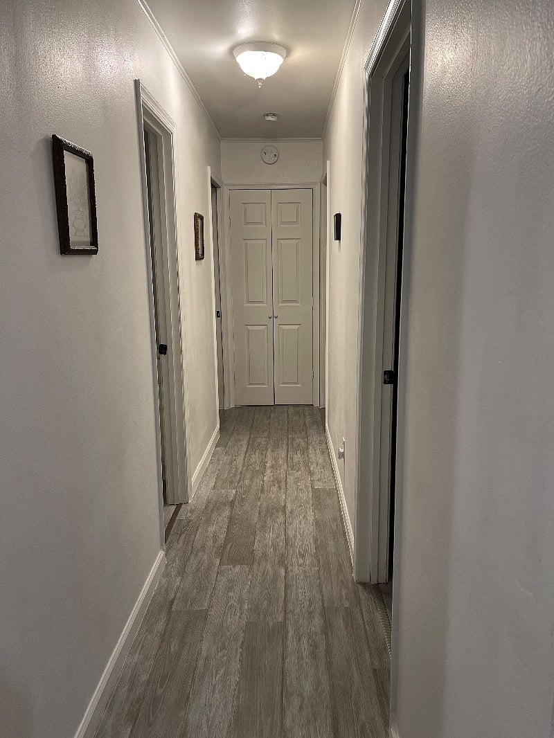The spacious hallway consists of the twin bedroom, the first door on the right. The shared bathroom is the next door on the left. The master bedroom is the last door on the left and the second queen bedroom is the last door on the right..