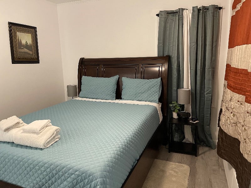 Master Bedroom with a USB lamp on both sides of the bed, smart TV, luggage rack, Two drawers built into the bed, and three built-in drawers at the bottom of the closet, hangers provided in the giant closet as well. Private ensuite full bathroom.