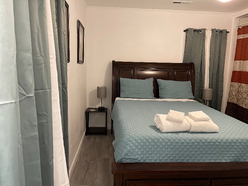 Master Bedroom with a USB lamp on both sides of the bed, smart TV, luggage rack, Two drawers built into the bed, and three built-in drawers at the bottom of the closet, hangers provided in the giant closet as well. Private ensuite full bathroom.