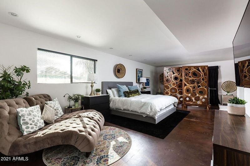 VIP Master Bedroom w/ king bed, rolling his & her lounge sofa chairs, smart TV, en suite bathtub, private bathroom/shower & direct side door to pool/hot tub.
