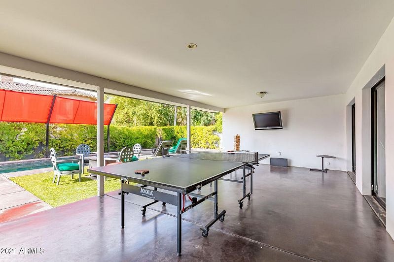 Patio ping pong table & Smart TV for fun game time while watching your favorite game time!