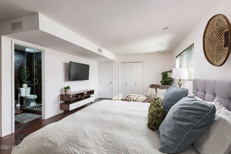 VIP Master Bedroom w/king bed & en suite bathroom TV/bathroom view.
