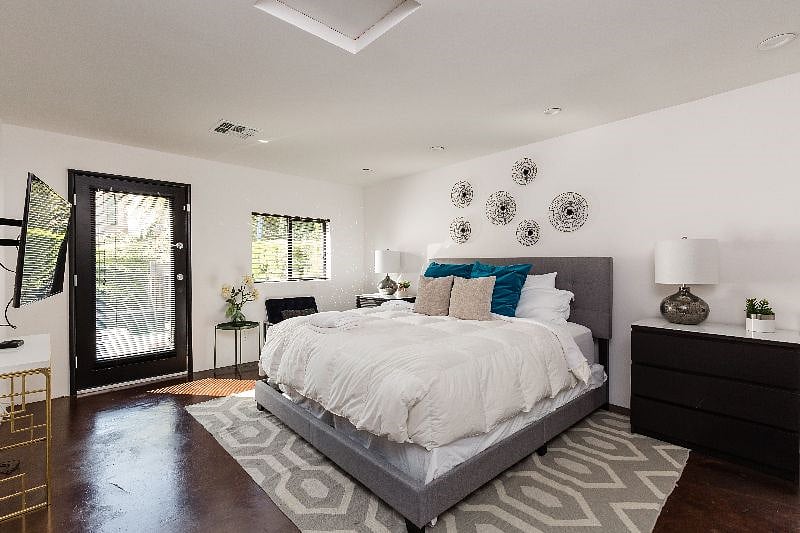 The 2nd Master Bedroom w/ King Bed and en-suite bathroom plus private door to the pool area.