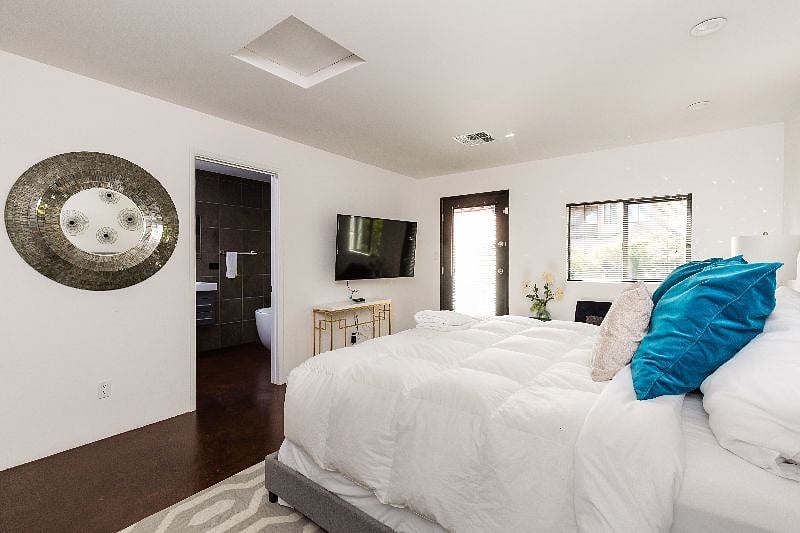 The 2nd Master Bedroom w/ King Bed and en-suite bathroom plus private door to the pool area.