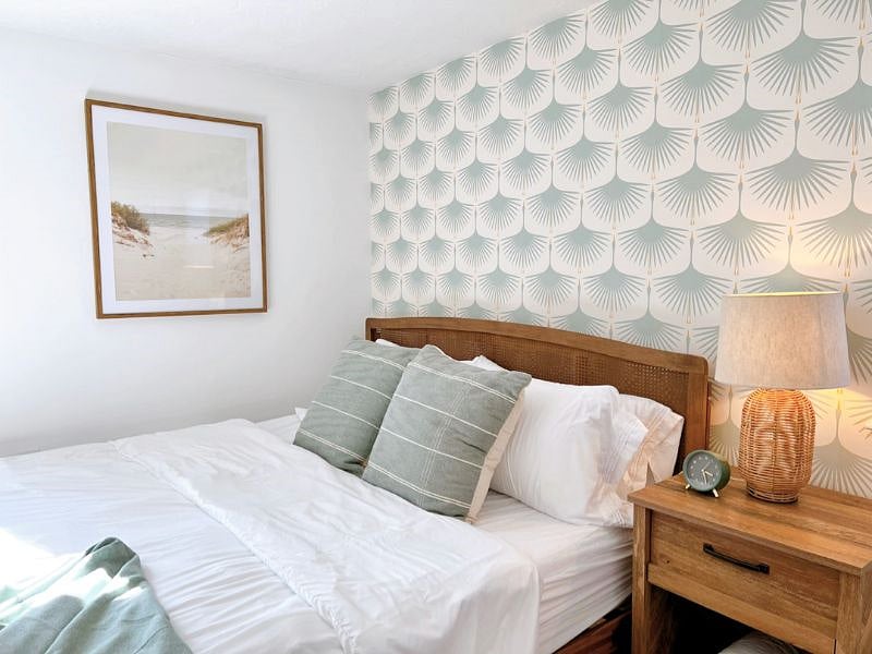 Tastefully decorated primary bedroom with king bed and ensuite bath