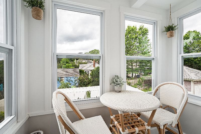 Relax in this bright and airy seating area, the perfect spot to enjoy your morning coffee with a view.