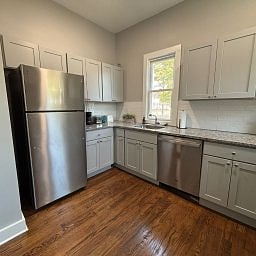 Kitchen featuring stainless steel appliances and ample cabinetry.