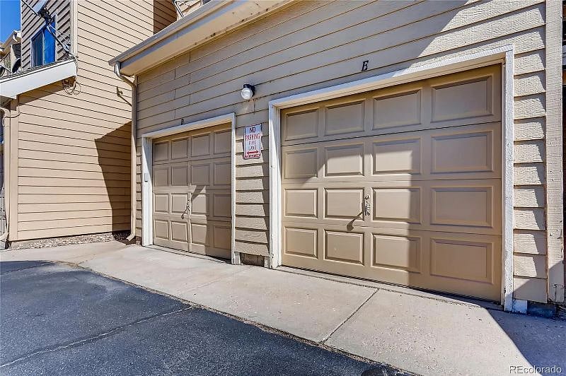 Single car garage (E) with additional shelving for storage