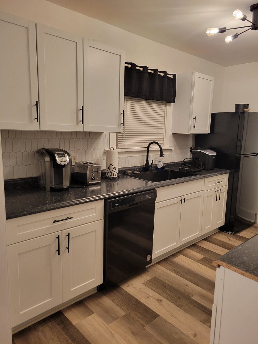 Beautiful decorated kitchen with all appliances, dishes, pots and pans need to make a delicious meal.