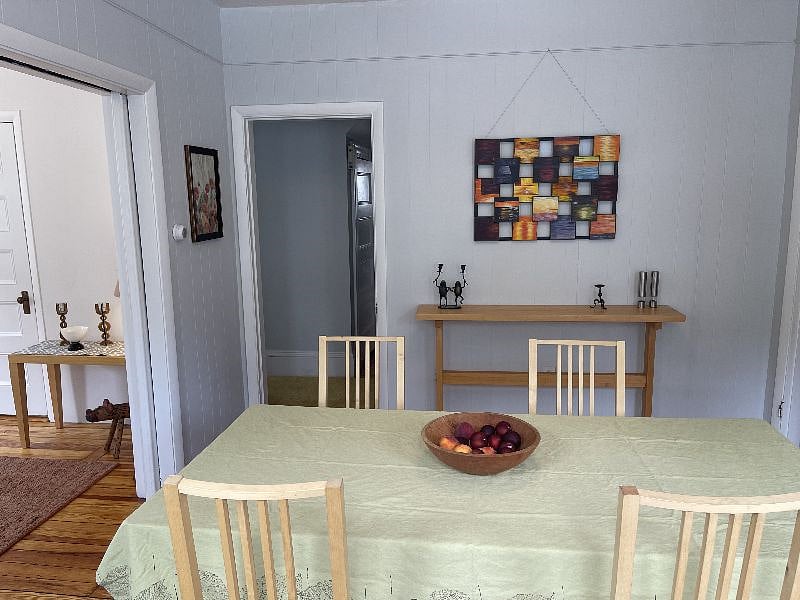 dining room set up for 4 people, but table can be expanded if needed.