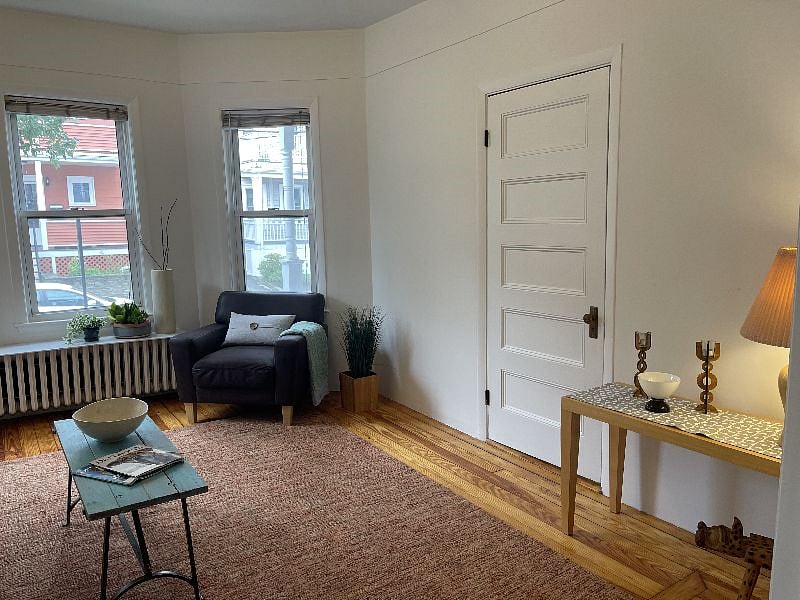 living room with bay windows open to dining room
anoth