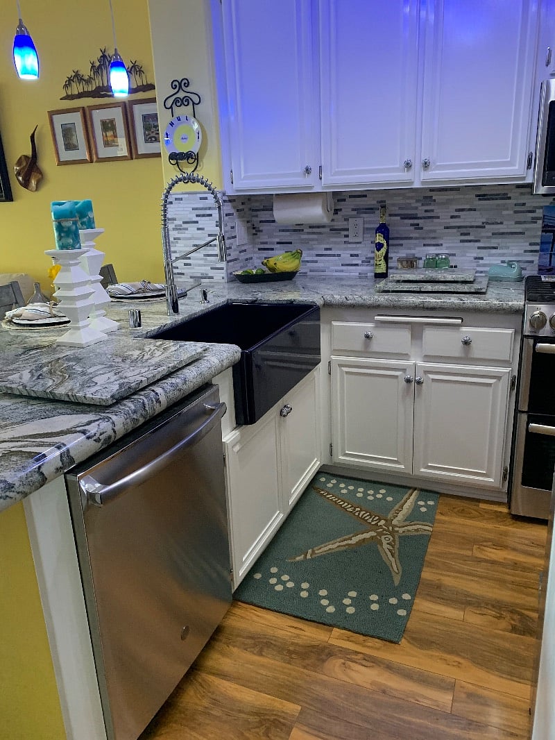 The kitchen has a beautiful cobalt blue farmhouse sink. The oven/stove, microwave and dishwasher are all GE Elite, full size washer and dryer and side by side refrigerator/freezer with door in door, ice maker and filtered water dispenser. 