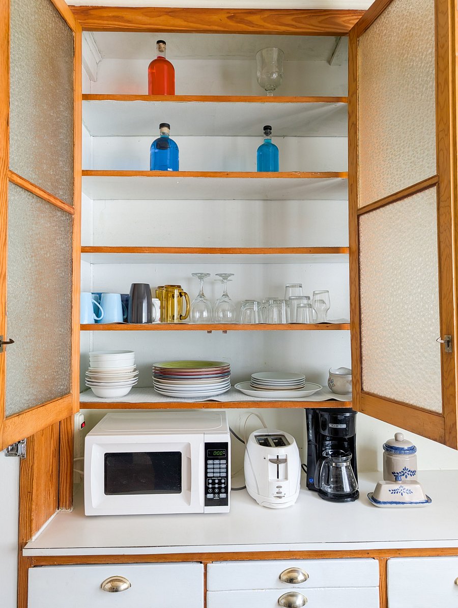 Microwave and plenty of storage. Cabinets stocked with common essentials.