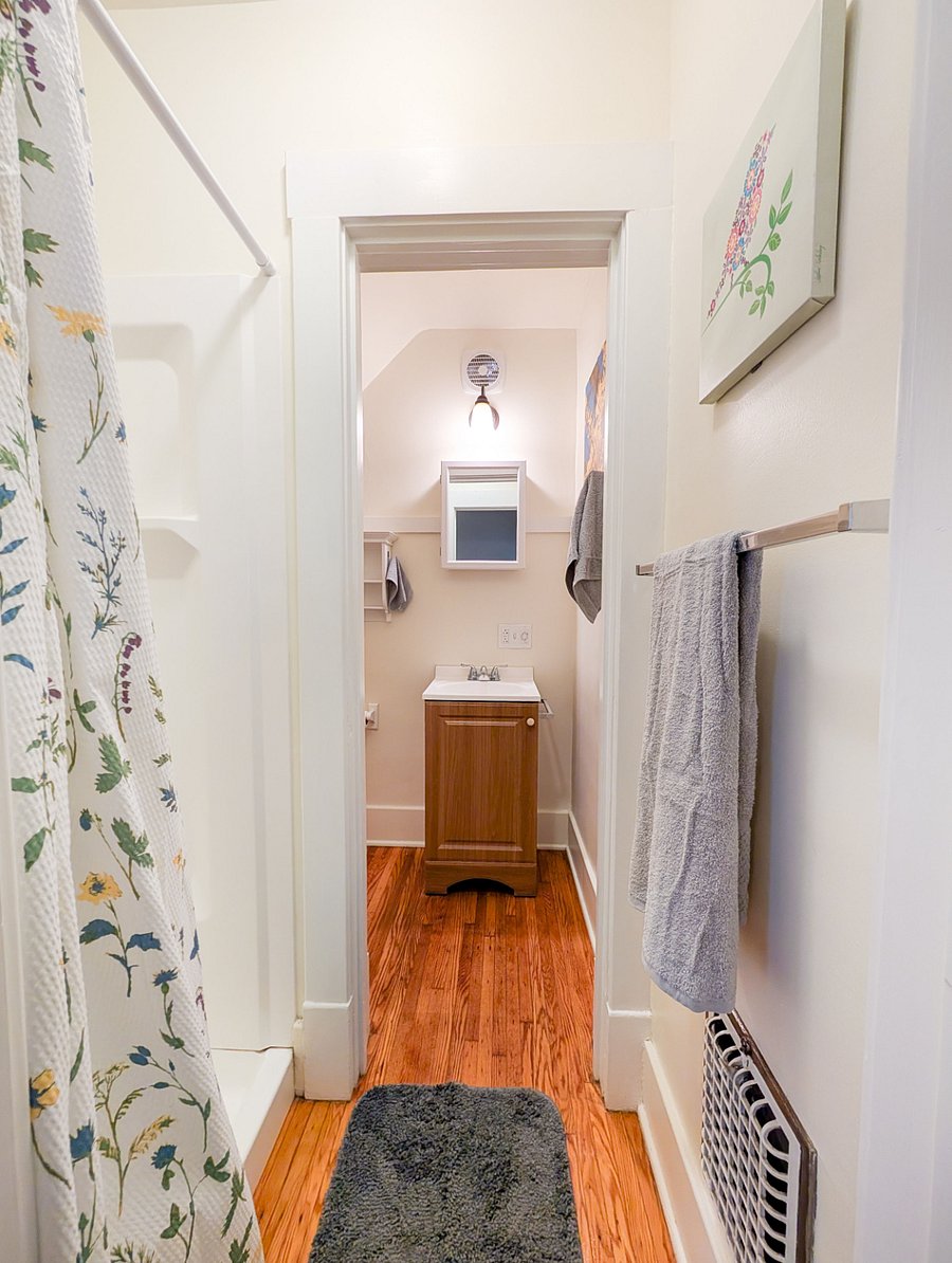 Bathroom #2
Newly renovated full bathroom with built-in storage and walk-in shower.
