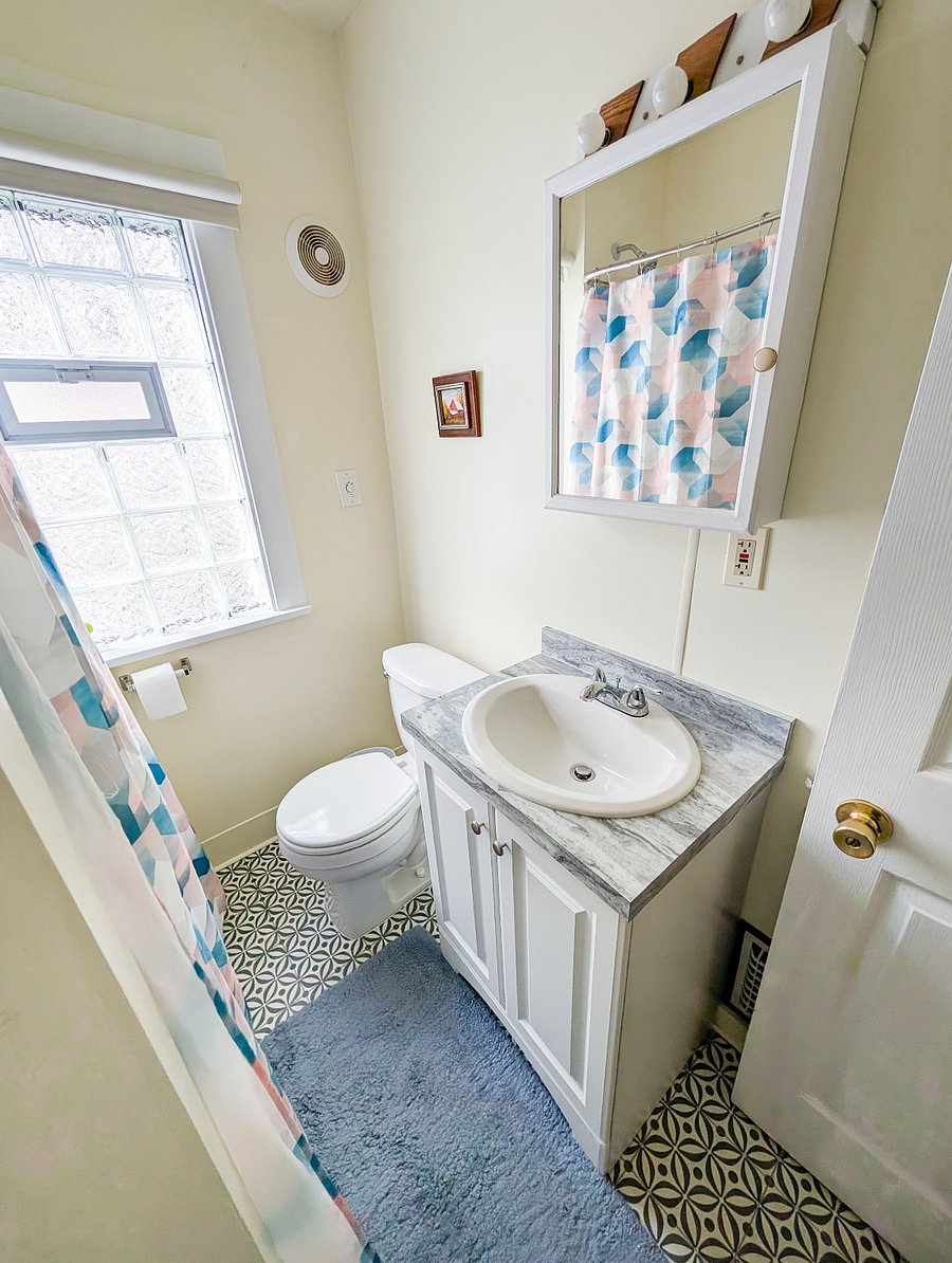 Bathroom #1
Clean and modern full bathroom with a tub/shower combo.