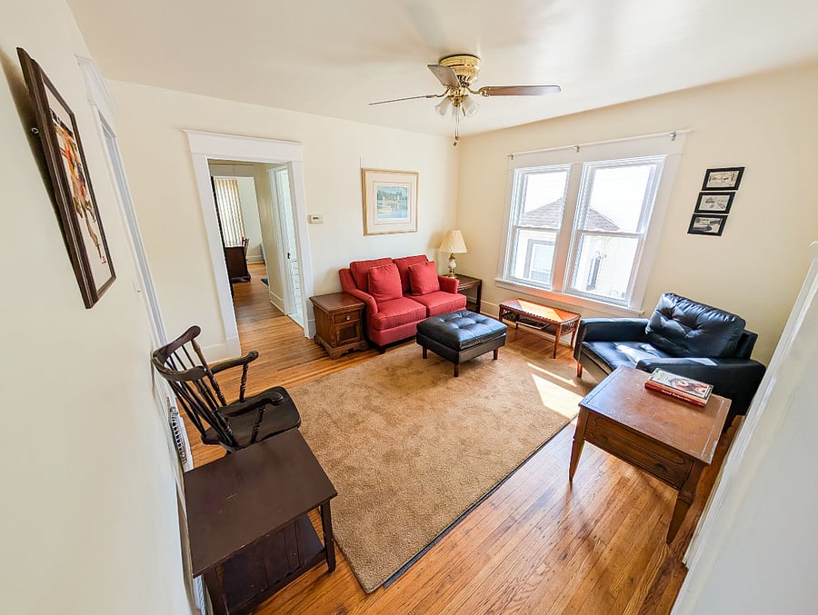 Bright and welcoming living space with a comfortable layout for relaxing or working.