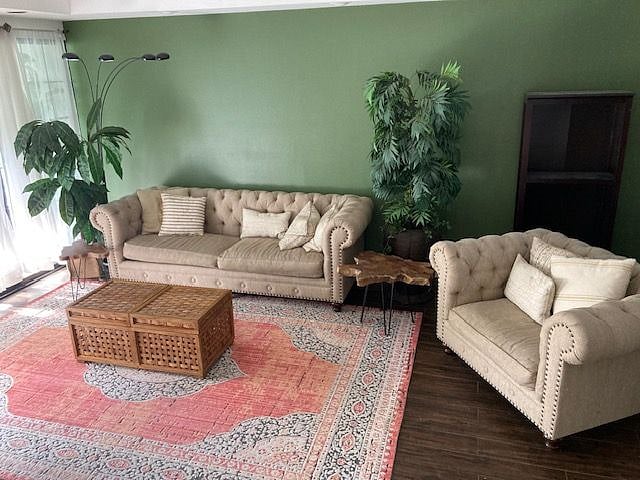 Living room with large glass windows facing east