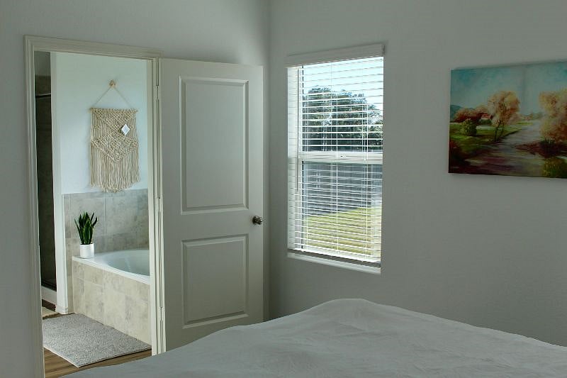 View of master bathroom from master bedroom.