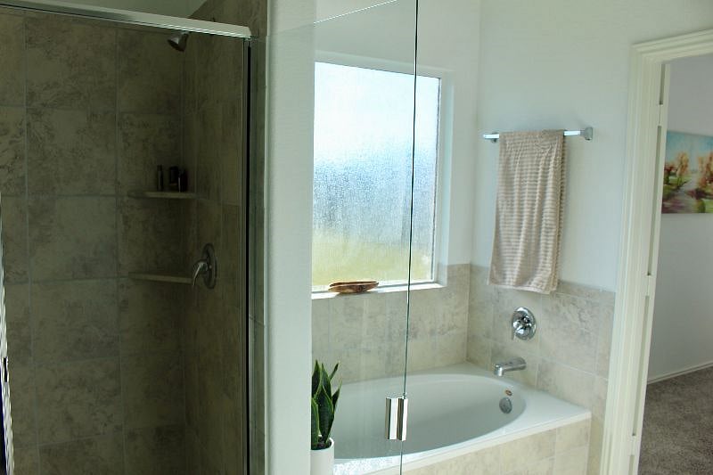The Master bathroom comes with a walk in closet, large soaking tub, and shower.