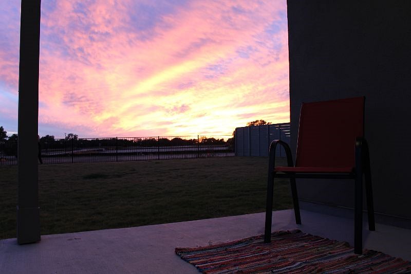 View of the sunset from the backyard porch.