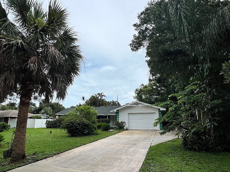 Front yard, parking & path to side door on the right