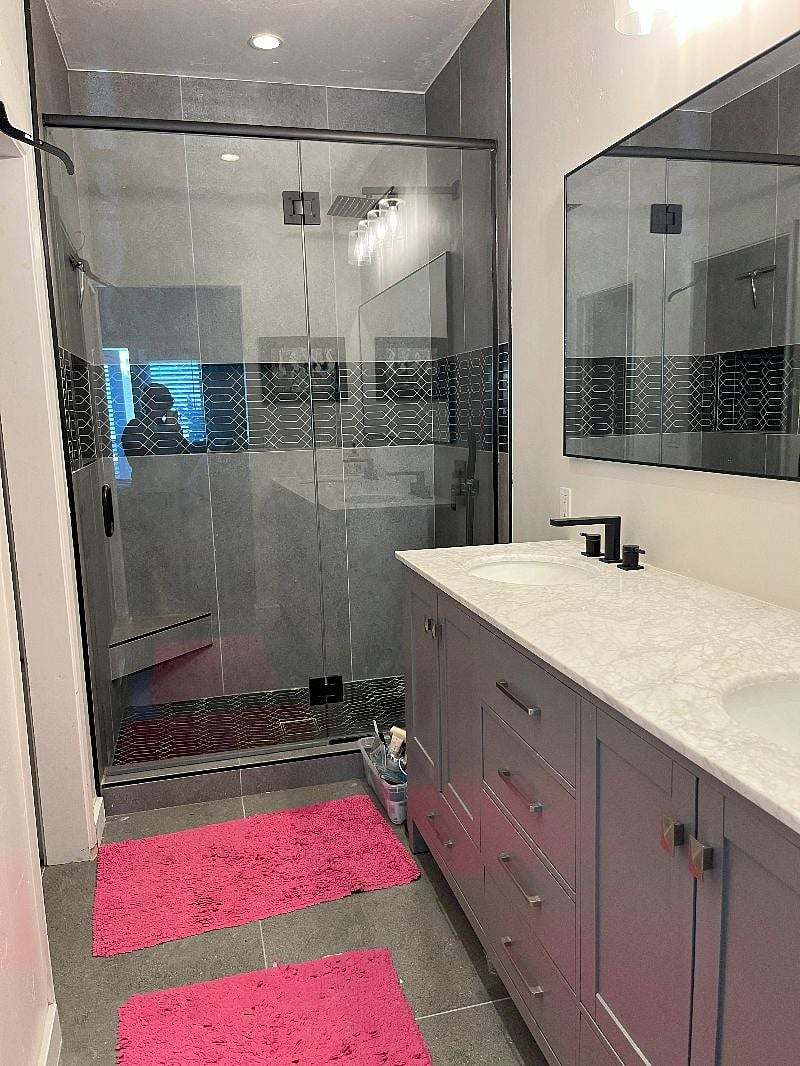 Main bathroom with dual sinks, and custom shower