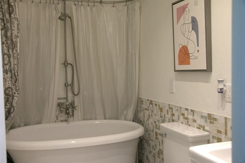 2nd full-bath with jetted soaking tub. Commode has a refreshing bidet.