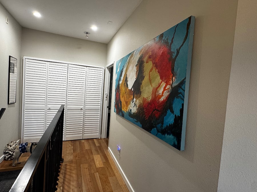 Hallway with washer and dryer to primary bedroom.
