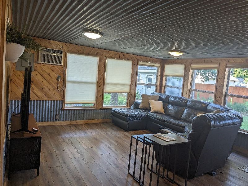 Den - leather couch sectional with electric recliners.