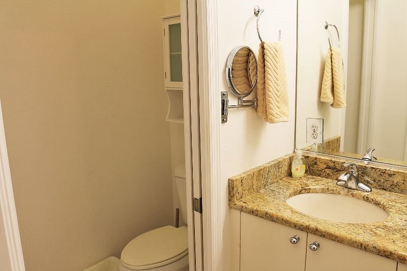 Master bath has double vanity, walk-in tiled shower.