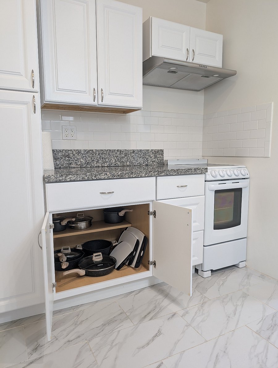 Kitchen has an 4-burner electric stove and oven.