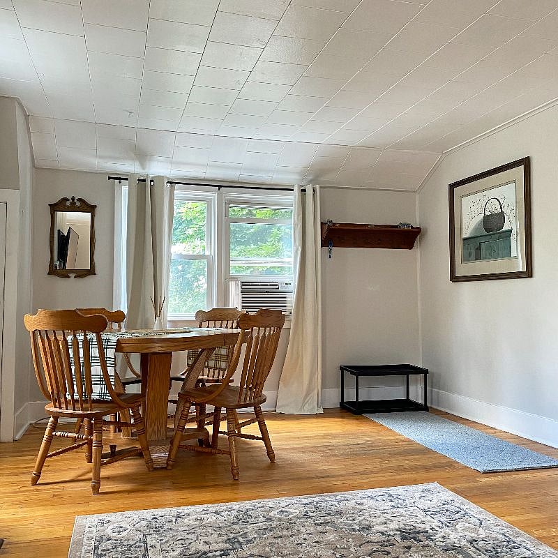 Dining and coat hanging area shared by the living room.