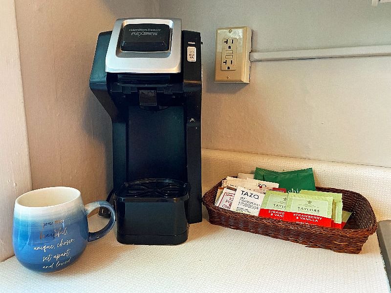Keurig and coffeepot are both in the kitchen.