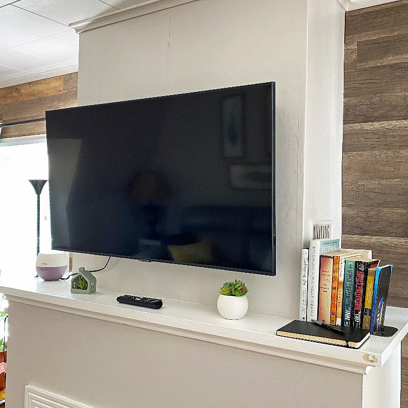 Tv above the mantle pulls out and can be directed different directions.