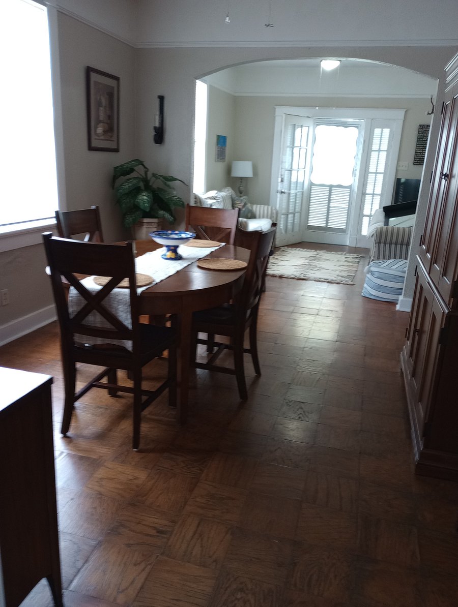 2'nd Parlor furnished as Dining Room with large table, four chairs, Buffet and Computer Desk Armoire