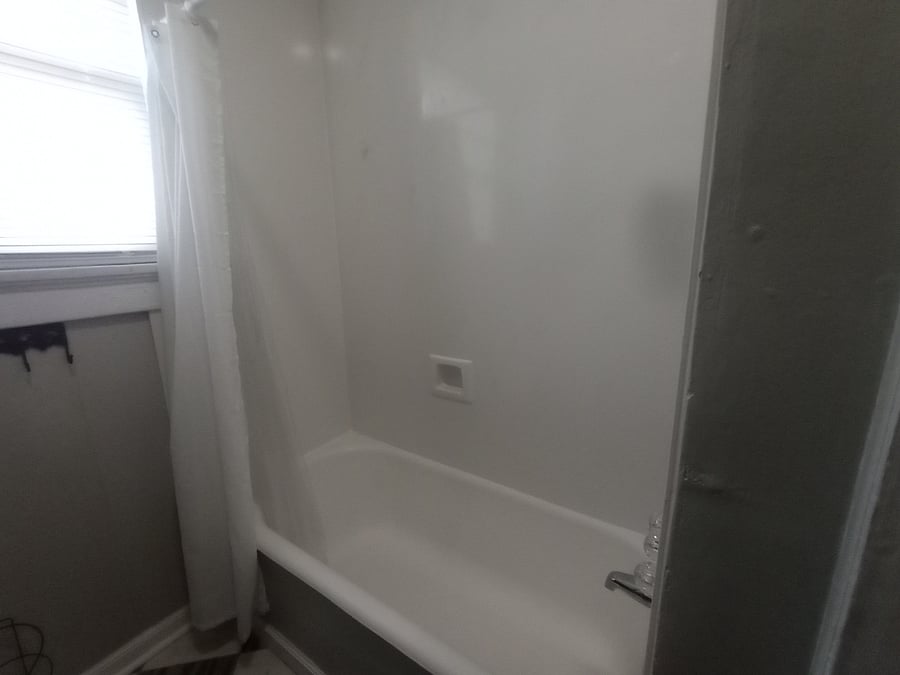 Original Large Cast Iron Tub with New Marble Tub Surround
