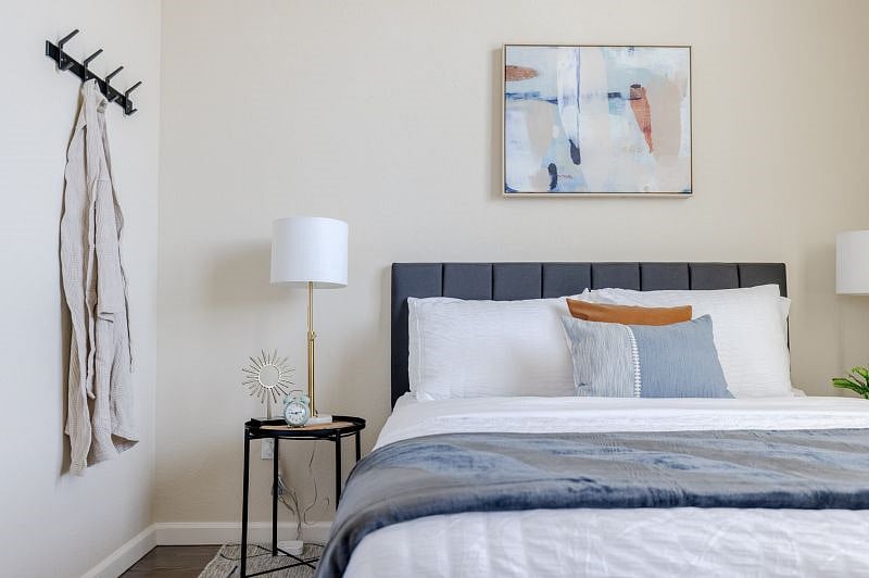 Main Level Bedroom 3 (Queen - sleeps 2) Designer touches and hotel like microfiber sheets. Multiple pillow options, easy access charger with multi ports, extra tall ceilings, natural light, ceiling fan.