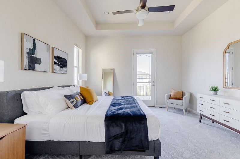 Primary Bedroom (King - sleeps 2) Clean bright and pristine. White sheets, extra pillows, fleece blanket and comfy comforter with duvet cover. Enjoy the walk out deck for your morning coffee or evening by the fire. Multiple easy access charing ports for all of your devices.
