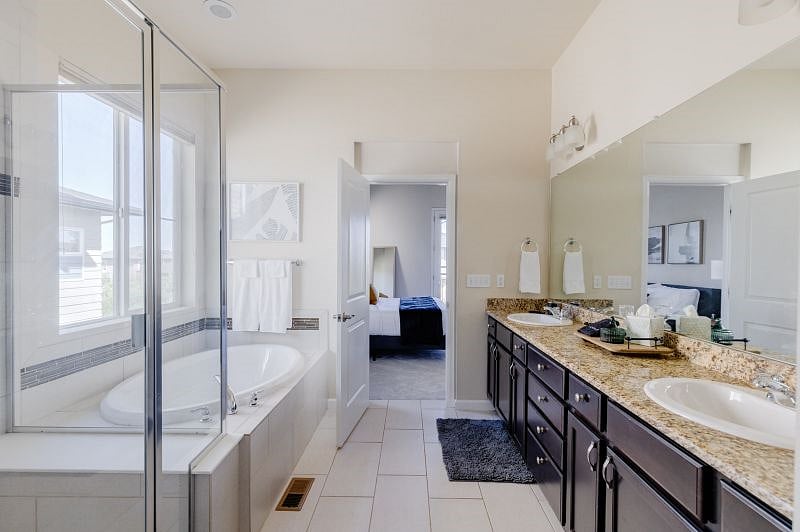Start your day or 'call it a day' in the large soaking tub and seated shower. There is double vanity for multiple people to get ready.
