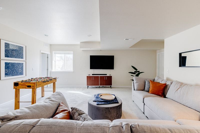 Game Room. Grab the pop corn and snacks for movie night. Log into your favorite streaming accounts with the smart tv and turn up the sound on the Sony sound bar. Large sectional sofa to spread out.