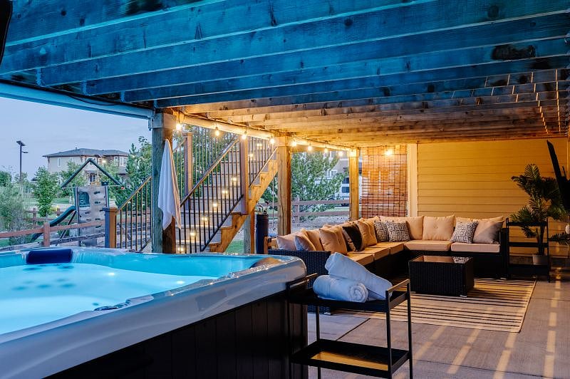 Wind down the day in this luxury outdoor living space! Grab a set in the sectional sofa, watch a show or the game on the outdoor smart TV.
